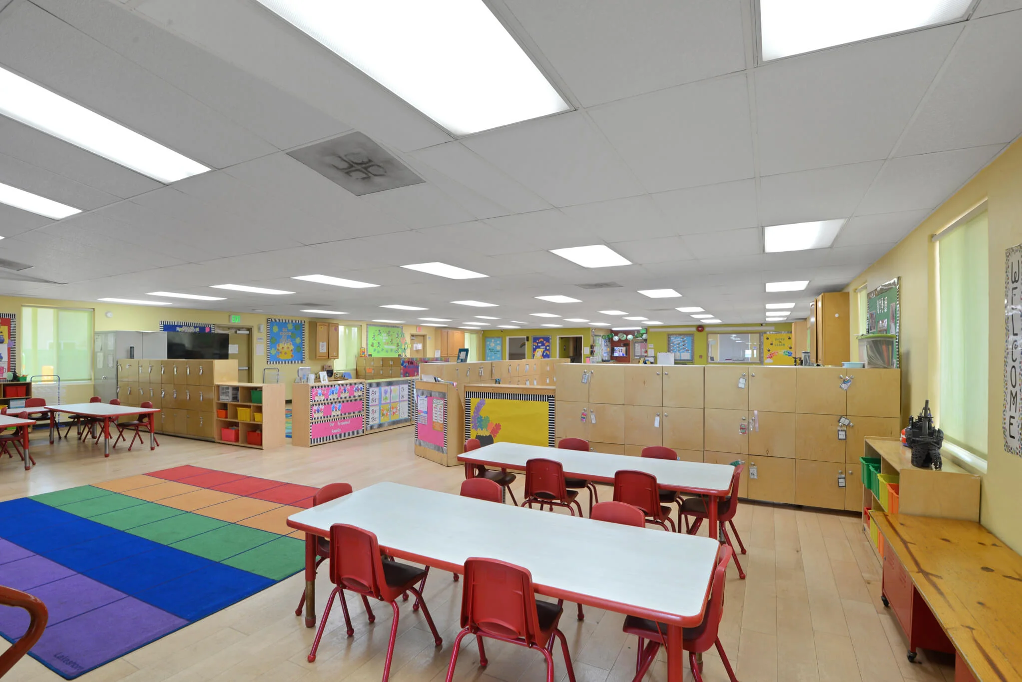 Four to five year old children engaging in theme-based learning with Montessori materials, science experiments, and hands-on activities in Pre-K at Sierra Preschool