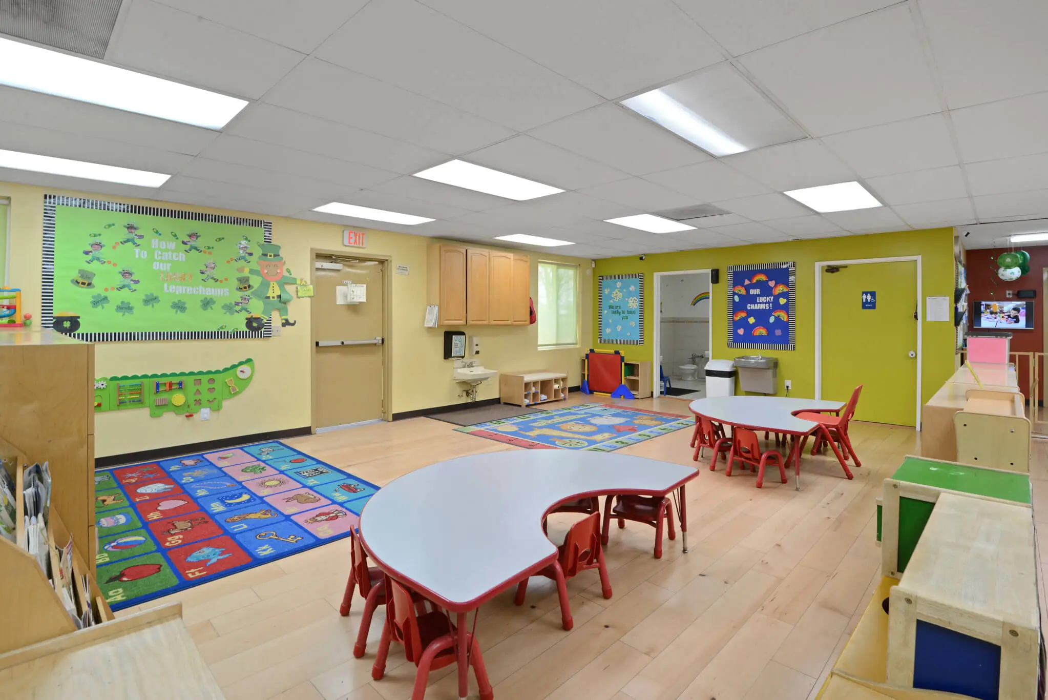 Toddler children engaged in hands-on exploration and guided learning activities in a safe, child-centered classroom at Sierra Preschool