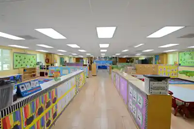 Safe outdoor playground with age-appropriate play structures, equipment, and secured play centers at Sierra Preschool