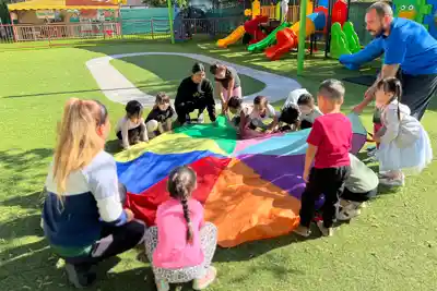 Children participating in dance and fitness enrichment at Sierra Preschool expressing themselves through movement and creative play