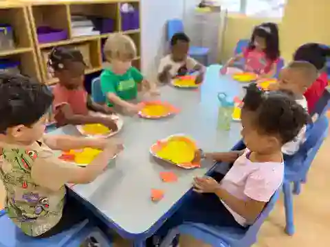Young toddlers engaged in hands-on classroom activity at Sierra Preschool's toddler program